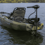 Kayak with trolling motor on water